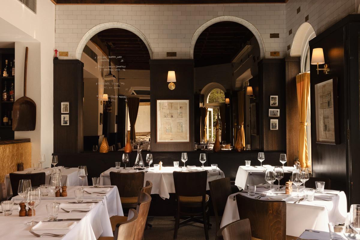 The Verde Darlinghurst dining room beneath sandstone arches